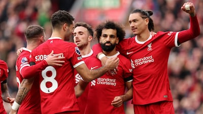 Liverpool celebrate Mohamed Salah's match winning penalty. Getty