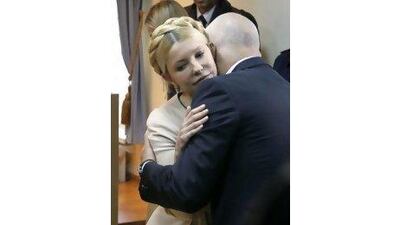 Former Ukrainian prime minister Yulia Tymoshenko is embraced by her husband Aleksandr as she is sentenced to seven years in prison for abuse of power. SERGEY DOLZHENKO / EPA