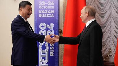 Mr Putin meets Mr Xi on the sidelines of the event. AFP