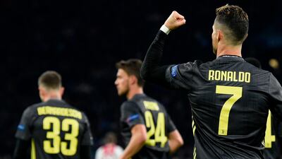 Juventus' Portuguese forward Cristiano Ronaldo celebrates after scoring a goal during the UEFA Champions League first leg quarter-final football match between Ajax and Juventus. AFP