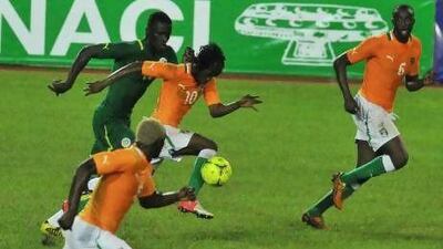 Gervinho, centre, and Yaya Toure, right, play in the Premier League for Arsenal and Manchester City, respectively.