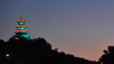 A temple is illuminated near Shougang park in Beijing. AFP