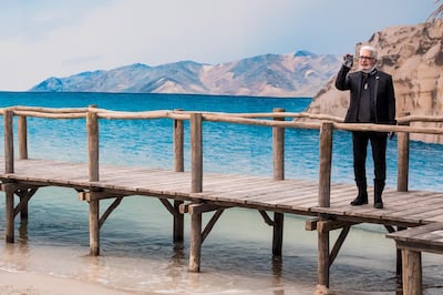 Karl Lagerfeld waves as models present creations from his spring / summer 2019 collection for Chanel during Paris Fashion Week on October 2, 2018. EPA
