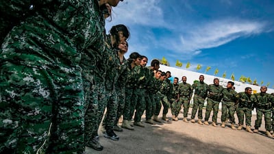 Fighters of the US-backed Kurdish-led Syrian Democratic Forces (SDF) dance as they celebrate near the Omar oil field in the eastern Syrian Deir Ezzor province after announcing the total elimination of ISIS. AFP