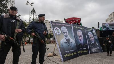 Hamas policemen in Gaza City stand guard. AFP / MAHMUD HAMS