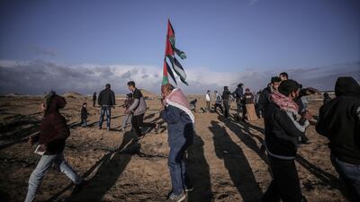 Palestinian protesters take part during clashes after Friday protest between Israeli troops and Palestinians protesters along the border between Israel and eastern Gaza Strip, 27 December 2019. EPA