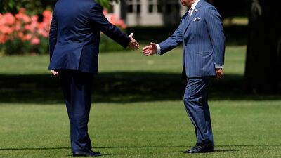 US President Donald Trump (L) shakes hands with Britain's Prince Charles, Prince of Wales (R) as he arrives for a welcome ceremony at Buckingham Palace in central London on June 3, 2019, on the first day of the US president and First Lady's three-day State Visit to the UK. AFP
