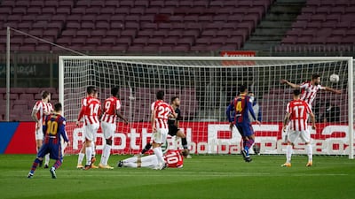 Barcelona's Lionel Messi scores from a free-kick to make it 1-0. Reuters