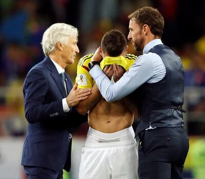 England manager Gareth Southgate, right and Colombia counterpart Jose Pekerman, left, consolve Colombia's Mateus Uribe after he failure from the penalty shoot-out against England in the last 16 of the 2018 World Cup. Reuters