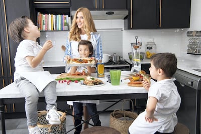 Lama Jamal, founder of Mamalu Kitchen, with her children. Photo: Uschi Irani