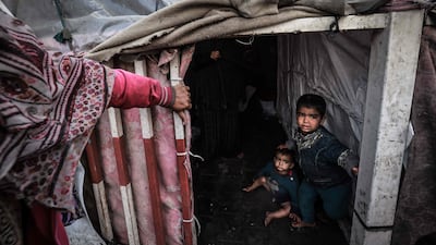 Palestinian children inside a makeshift tent at a camp in Rafah, southern Gaza. AFP