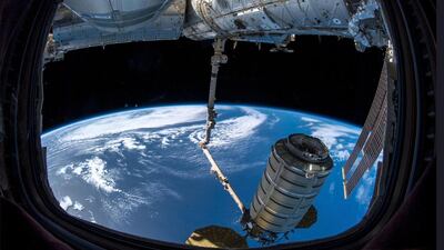 A shipment arrives at the International Space Station, where astronauts use a robotic arm to grab the 'SS John Young' cargo capsule, containing the UAE's MySat-1 satellite. SP