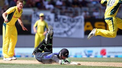 Martin Guptill of New Zealand (C) is run out during the first one-day international cricket match between New Zealand and Australia at Eden Park in Auckland on February 3, 2016. Michael Bradley / AFP