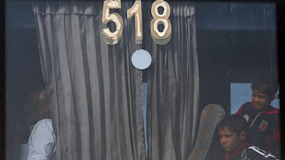 Iraqis sit in a bus transporting displaced families from a camp in Habbaniyah in Iraq's Anbar province. AFP