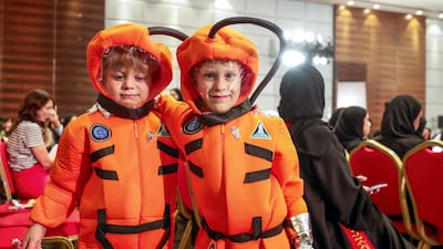 (L-R) Henry Munce and Thomas Wuisman dress as astronauts to watch the launch at Adnec. Victor Besa / The National
