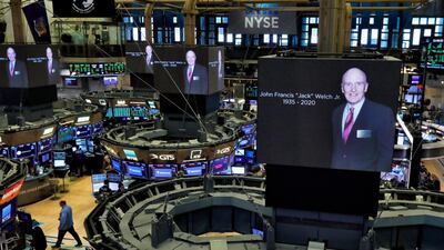 Images of Jack Welch on screens above trading posts on the floor of the New York Stock Exchange, on March 2, 2020. Welch transformed General Electric into a highly profitable multinational conglomerate. He died at the age of 84. AP