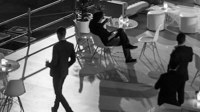People relax before an event at night in the DIFC - a regular haunt of Frank Kane's. Antonie Robertson / The National