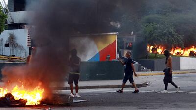 Venezuelans set a small police station on fire during a protest against the government in Valencia, Carabobo state. AFP