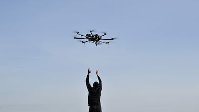 A pilot operates a drone at a training ground in the Kyiv region. AFP