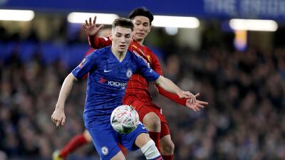 Billy Gilmour takes the ball away from Takumi Minamino. AP Photo