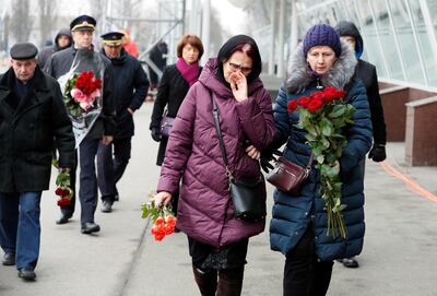 Relatives of the eleven Ukrainian victims arrive for the memorial ceremony at the Boryspil International Airport. Reuters