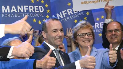 The top candidate of the European People's Party (EPP), Manfred Weber (C) of Germany celebrates with his supporters after the result of the voting at the European People's Party (EPP) congress in Helsinki. (AFP)