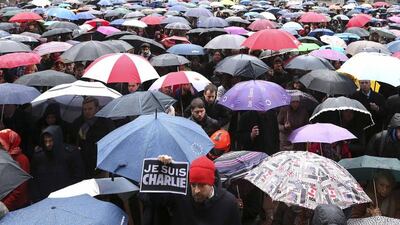 A man holds a placard that reads “I am Charlie” as European MPs and citizens gather in front of the EU Parliament in Brussels on January 8, 2015, to observe a minute of silence for victims of the shooting at French weekly newspaper Charlie Hebdo. Francois Lenoir / Reuters