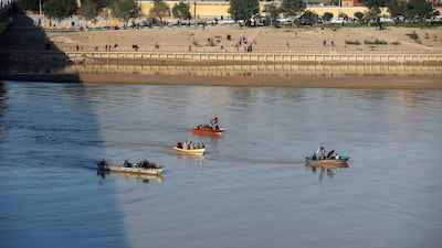People in boats sail during a funeral procession for Qassem Suleimani, head of the elite Quds Force, and Iraqi militia commander Abu Mahdi Al Muhandis, who were killed in an air strike at Baghdad airport, in Ahvaz, Iran. Reuters