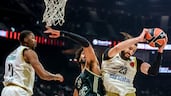 Tornike Shengelia of Dubai Basketball, right, wins the ball from Olivier Sarr of Real Madrid at Etihad Arena. Victor Besa / The National