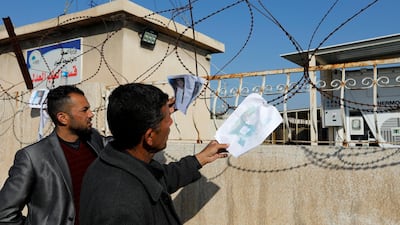 People look at pictures of victims. Reuters