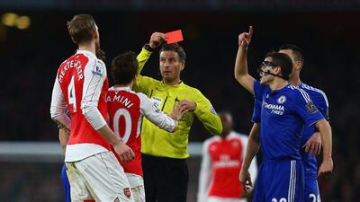 Per Mertesacker is shown red on Sunday night during his team’s loss to Chelsea in the Premier League. Clive Mason / Getty Images