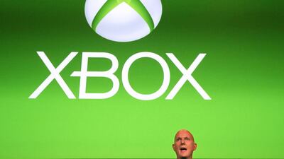 Phil Harrison, corporate vice president of Microsoft, stands in front of a Xbox logo during the Xbox Play Day 2014. Wolfgang Rattay / Reuters