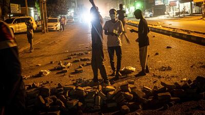 Sudanese protesters make a barricade on a road during their protest calling for the civilian government in Omdurman, the twin city of capital city Khartoum. AFP