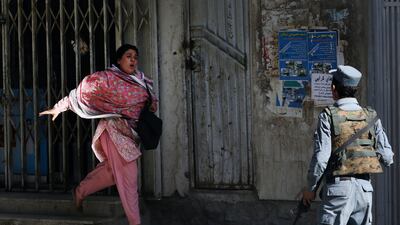 Women rush to leave the scene of the bombing. Hedayatullah Amid / EPA