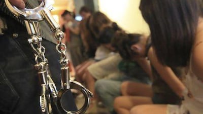 A police crackdown action on prostitution in Wenzhou, Zhejiang province. Prostitution is not permitted under Chinese law, although the industry has boomed since the country launched economic reforms in 1978.