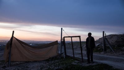 Ayad Gboha, a Bedouin father of seven children, stand nears the makeshift fence outside his home in Al Poraa on February 4, 2018. Heidi Levine