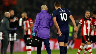 Tottenham Hotspur striker Harry Kane leaves the pitch after injuring his hamstring against Southampton on New Year's Day. AFP