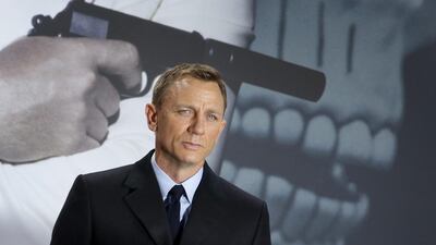 The latest 007, Daniel Craig, brings a different tone to the role of James Bond. Michael Sohn / AP