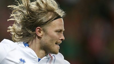 Birkir Bjarnason of Iceland celebrates scoring the equaliser during the Uefa Euro 2016 group F preliminary round match between Portugal and Iceland at Stade Geoffroy Guichard in Saint-Etienne, France, 14 June 2016. Yuri Kochetkov / EPA