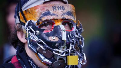 A man takes part in an anti-mask rally in Montreal. The Canadian Press via AP