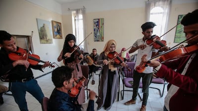 Yemeni students play violins during a music class at the Cultural Centre in Sanaa, Yemen. Hani Mohammed / AP Photo