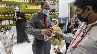 Delegates and visitors taste and try the produce on offer