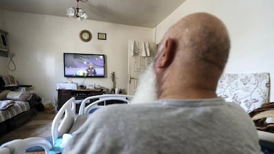 Mohammed Ishaq, a member of the UAE squad that played in the 1996 Cricket World Cup, watches a match at the ongoing 2019 Cricket World Cup from his bed in his front room of his flat in Abu Dhabi. All other photos by Pawan Singh / The National