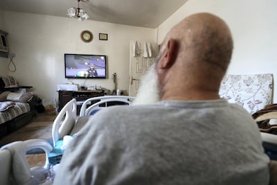 Mohammed Ishaq watches a match at the 2019 Cricket World Cup from his bed in his front room of his flat in Abu Dhabi. Pawan Singh / The National