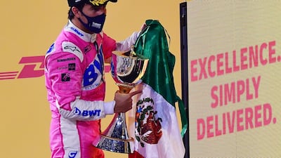 Racing Point's Sergio Perez celebrates on the podium with a Mexican flag after winning the race in Bahrain. Reuters