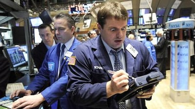 Traders at work on the floor of the New York Stock Exchange at the start of the trading day.