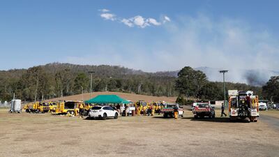 Fire and Emergency crew from New South Wales prepare to join ongoing bushfire control efforts near the rural town of Canungra in Queensland, Australia. EPA