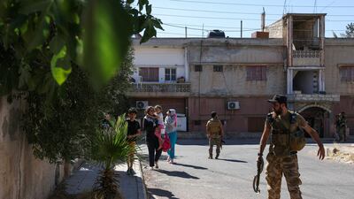 Troops patrol an area as residents flee their homes amid clashes. AFP