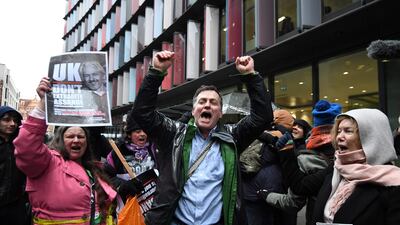 Supporters of Wikileaks founder Julian Assange celebrate outside the Old Bailey. AFP
