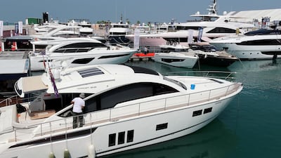 Luxurious yachts line the waters in Dubai. Pawan Singh / The National